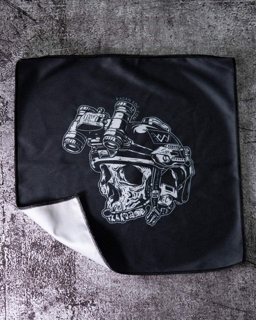 Black leather jacket with a white skull and mechanical design on a textured surface
