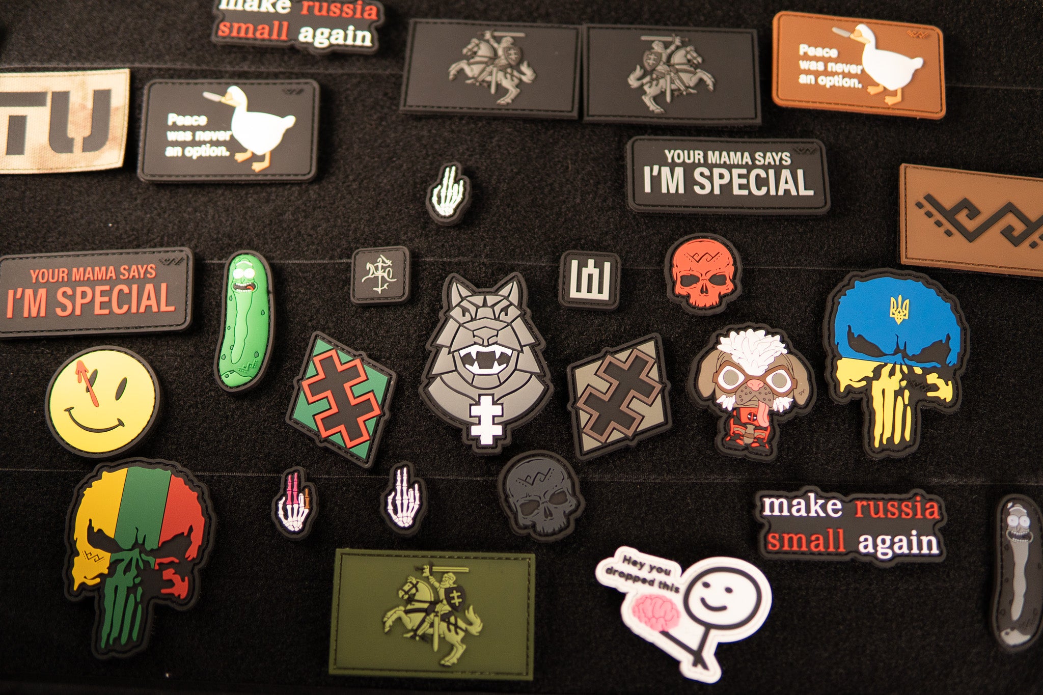 Collection of PaganEDC PVC morale patches displayed on a Velcro panel
