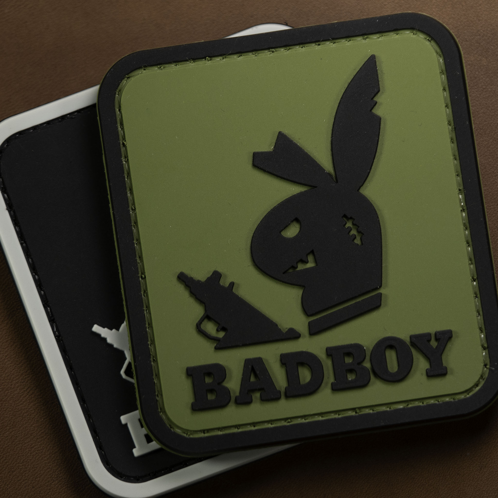 PVC patch “Badboy” in green and black with raised 3D design and Velcro backing.