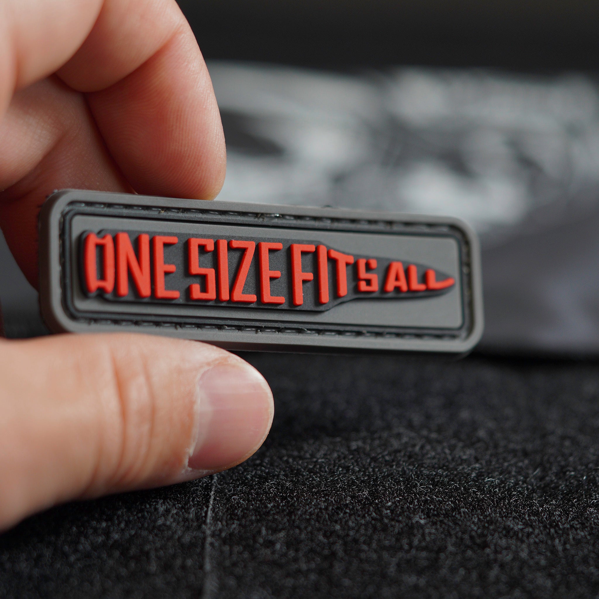 “One Size Fits All” bullet-shaped PVC patch held by hand