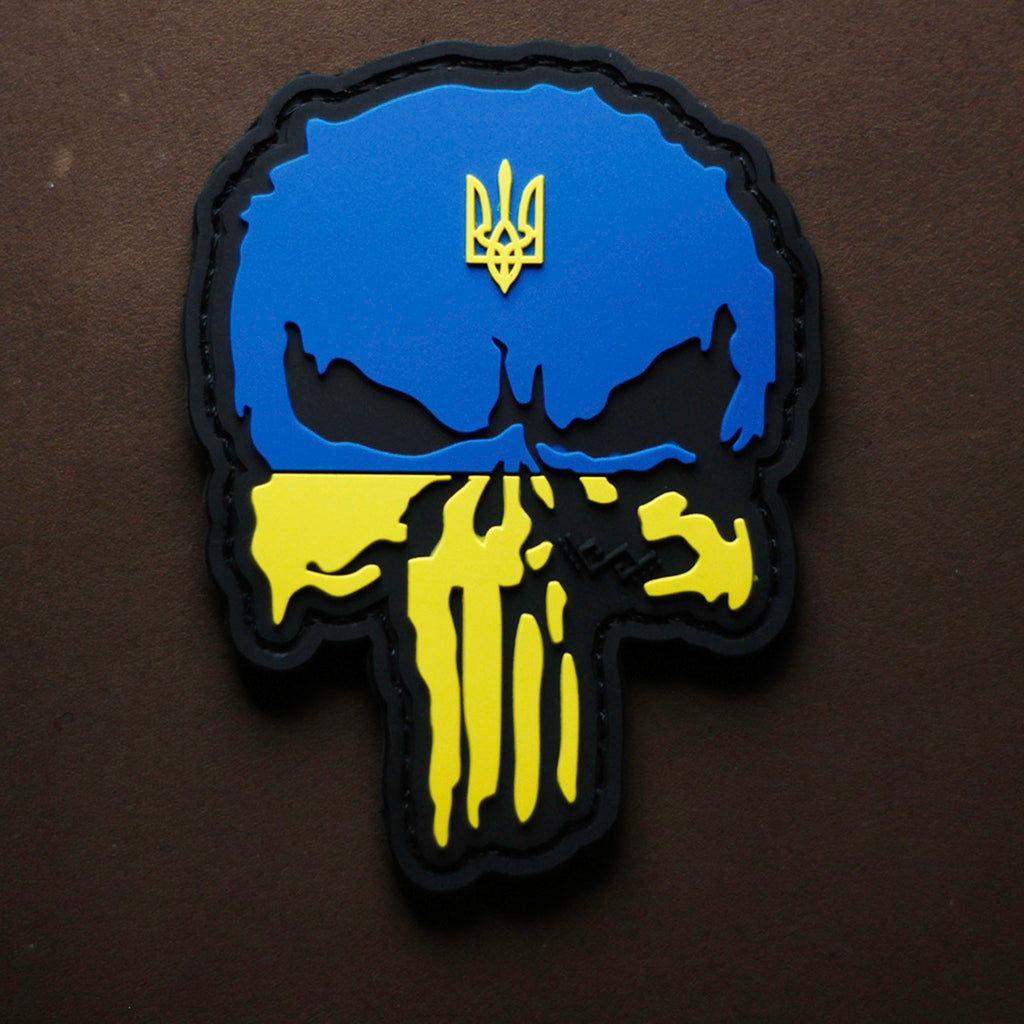 PVC patch featuring a Punisher skull design in Ukrainian flag colors with a trident emblem.