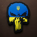 PVC patch featuring a Punisher skull design in Ukrainian flag colors with a trident emblem.