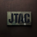 Camouflage JTAC laser-cut patch with black lettering displayed on a dark surface.